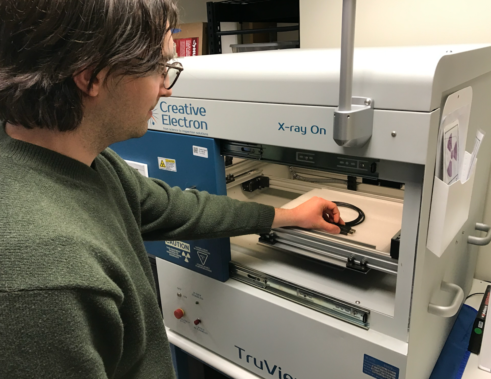Eclypsium researcher preparing to x-ray a suspicious USB cable.